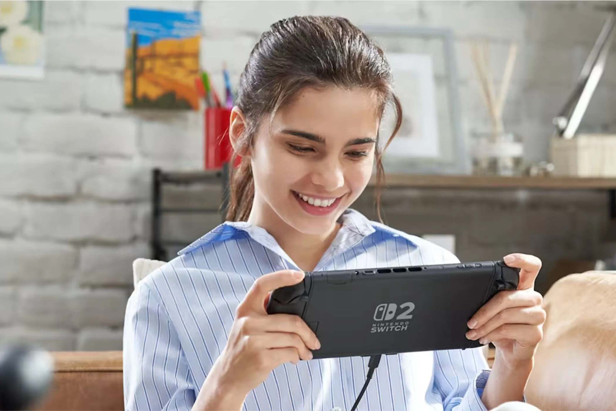 Người chơi sử dụng máy Nintendo Switch 2 ở chế độ handheld