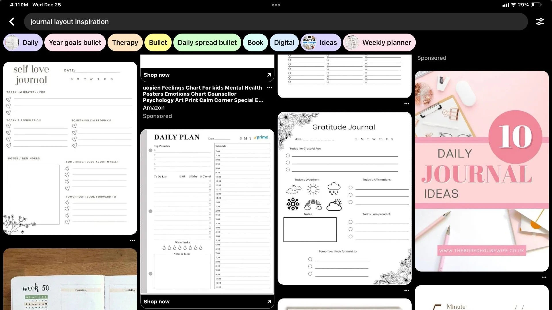 A person browsing Pinterest on a tablet, looking for inspiration for digital journal layouts, highlighting the creative community as a source of ideas.