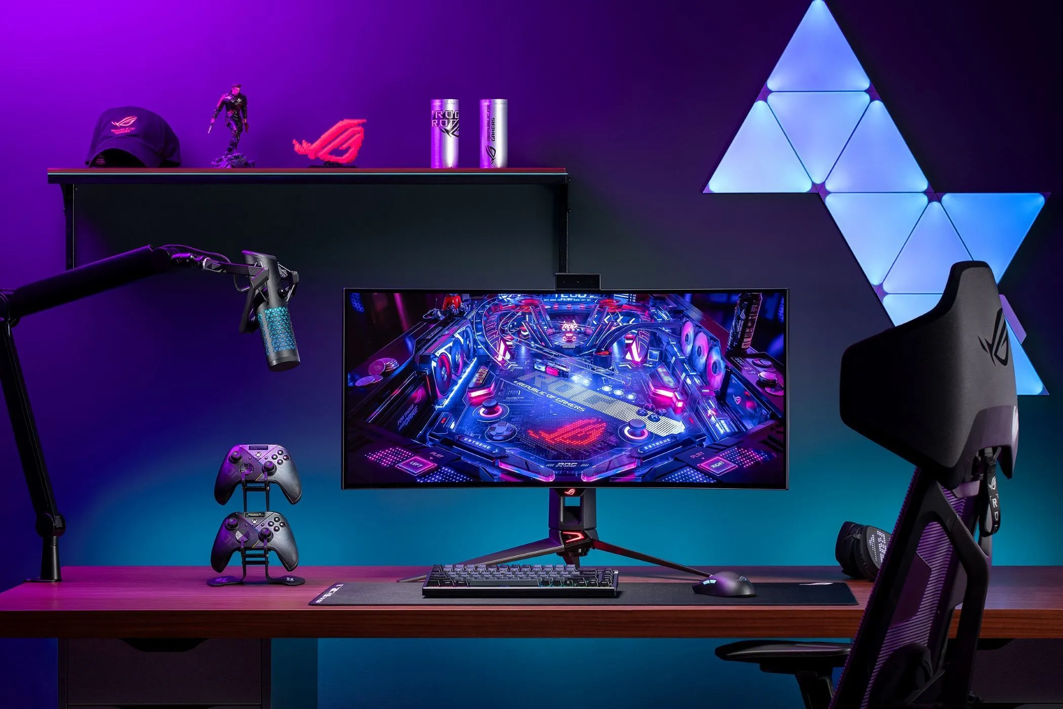 Bộ máy tính chơi game với màn hình ASUS ROG Swift PG34WCDM, minh họa trải nghiệm gaming với tần số quét cao.