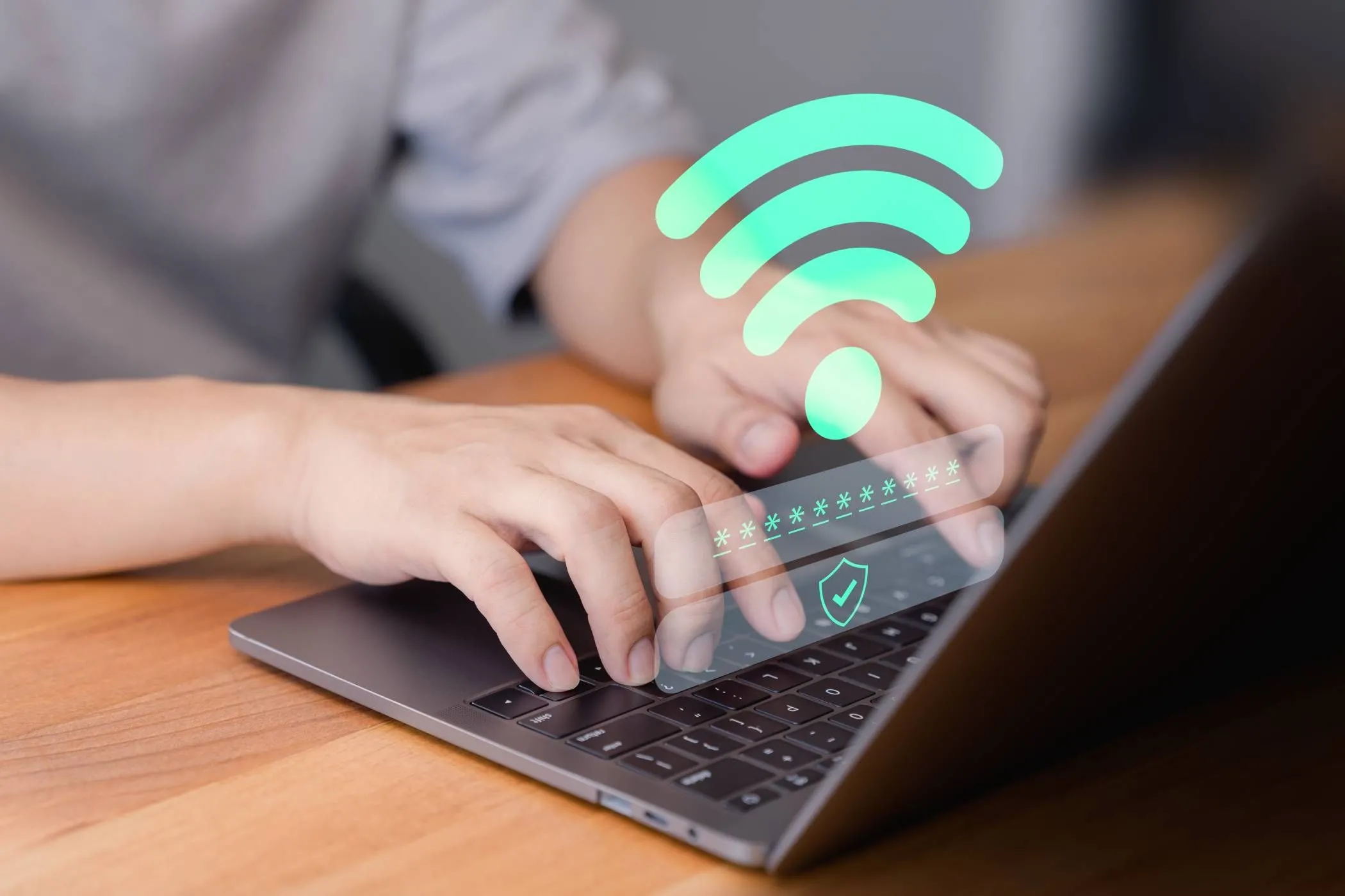 Người dùng đang nhập mật khẩu Wi-Fi an toàn trên laptop với biểu tượng bảo mật hiển thị